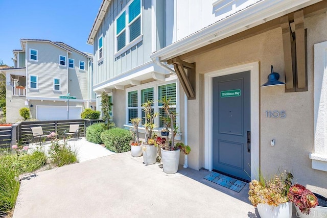1105 Hibiscus Way, Oceanside, CA 92054 - doorway to property featuring board and batten siding and stucco siding