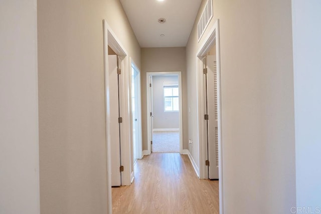 1105 Hibiscus Way, Oceanside, CA 92054 - hallway with light wood finished floors and baseboards