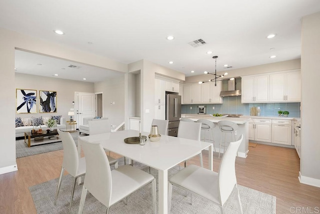 1105 Hibiscus Way, Oceanside, CA 92054 - dining area featuring light wood-style flooring, recessed lighting, a chandelier, and baseboards