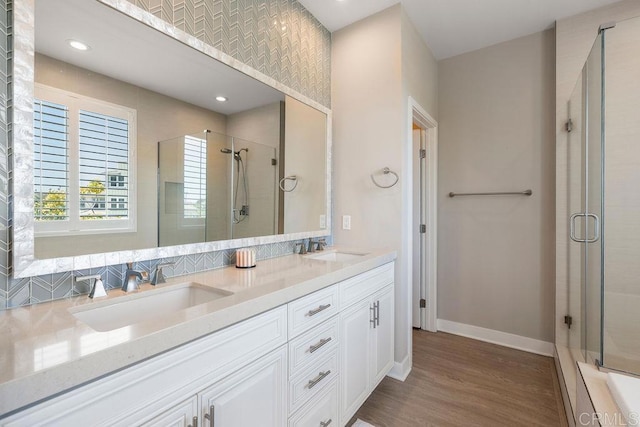 1105 Hibiscus Way, Oceanside, CA 92054 - full bath with an enclosed shower, double vanity, wood finished floors, and recessed lighting