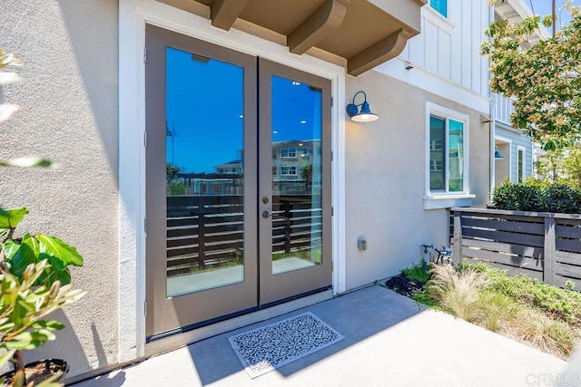 1105 Hibiscus Way, Oceanside, CA 92054 - entrance to property featuring french doors, board and batten siding, and stucco siding