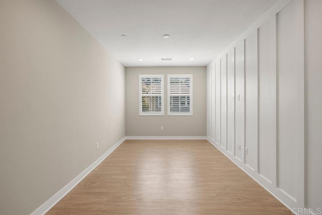 1105 Hibiscus Way, Oceanside, CA 92054 - unfurnished room with light wood finished floors, baseboards, and recessed lighting