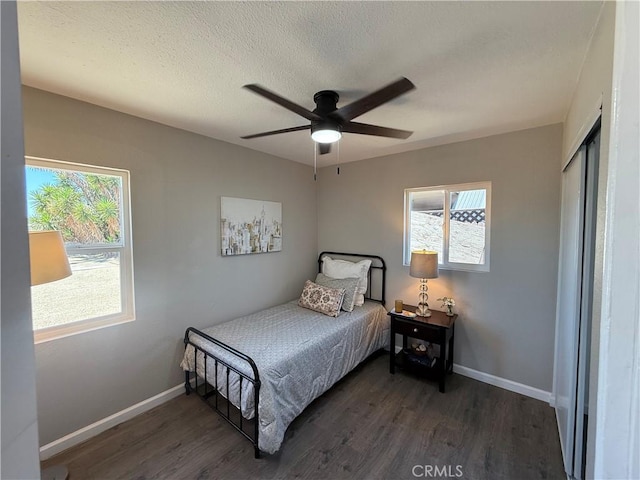 9196 Redwood Ave, Fontana, CA 92335 - bedroom with wood finished floors, multiple windows, and baseboards