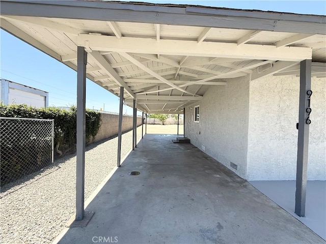 9196 Redwood Ave, Fontana, CA 92335 - view of parking featuring an attached carport