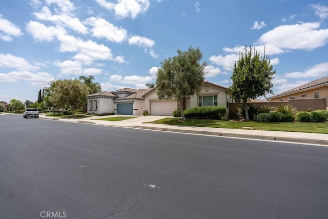 29557 Warmsprings Dr, Menifee, CA 92584 - view of front of house with concrete driveway, stucco siding, a garage, and a residential view