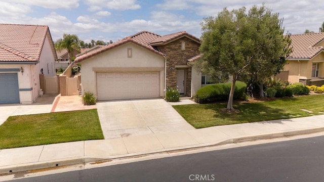29557 Warmsprings Dr, Menifee, CA 92584 - mediterranean / spanish-style home with a tiled roof, stucco siding, stone siding, an attached garage, and concrete driveway