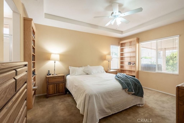 29557 Warmsprings Dr, Menifee, CA 92584 - bedroom with carpet floors, a raised ceiling, baseboards, and ceiling fan