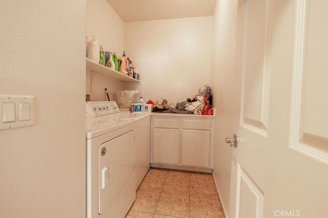 29557 Warmsprings Dr, Menifee, CA 92584 - laundry area featuring washer and dryer, light tile patterned floors, and cabinet space