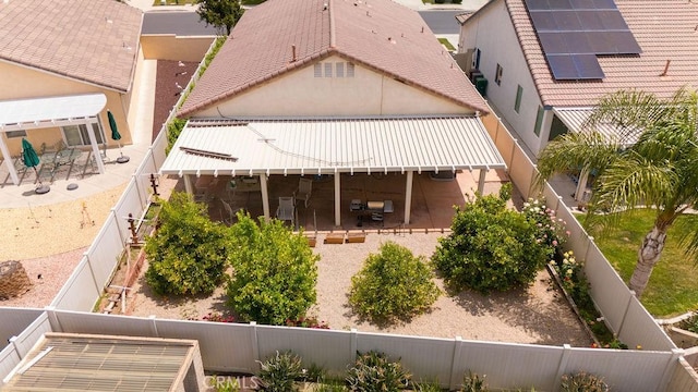 29557 Warmsprings Dr, Menifee, CA 92584 - back of house featuring a fenced backyard, solar panels, a patio, and stucco siding