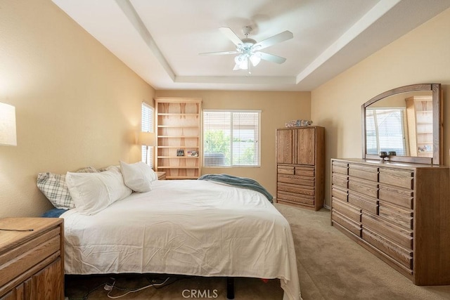 29557 Warmsprings Dr, Menifee, CA 92584 - bedroom featuring light carpet, a raised ceiling, and ceiling fan