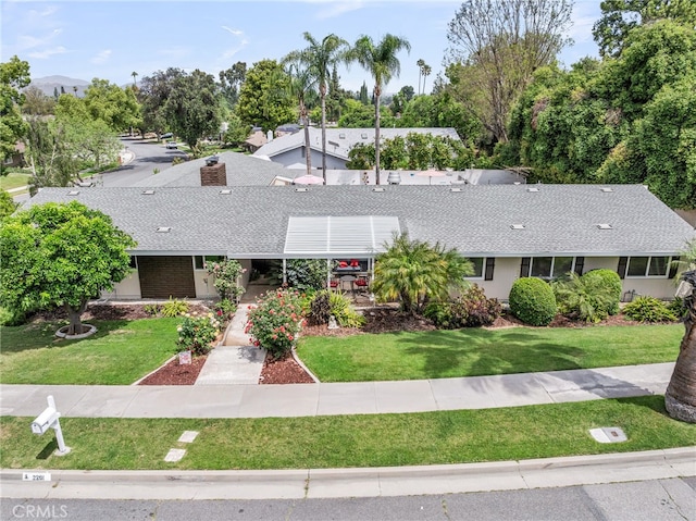 2201 Archdale St, Riverside, CA 92506 - view of front facade with roof with shingles and a front yard