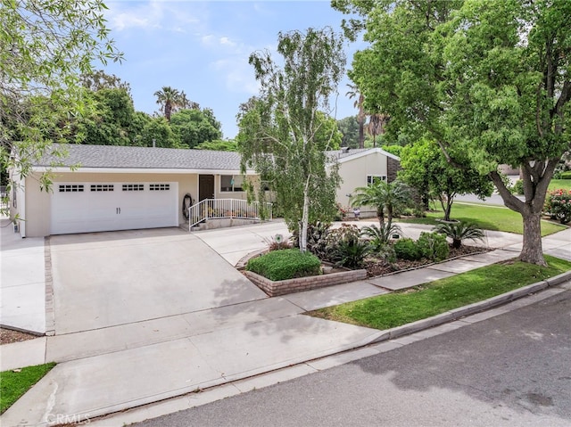 2201 Archdale St, Riverside, CA 92506 - view of front of property featuring driveway, an attached garage, and stucco siding