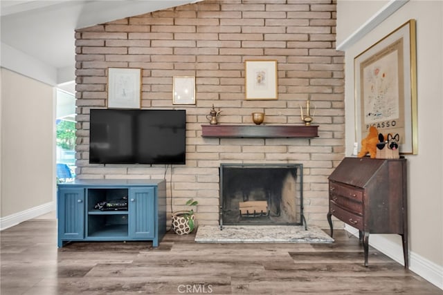 2201 Archdale St, Riverside, CA 92506 - living area featuring a brick fireplace, baseboards, and wood finished floors