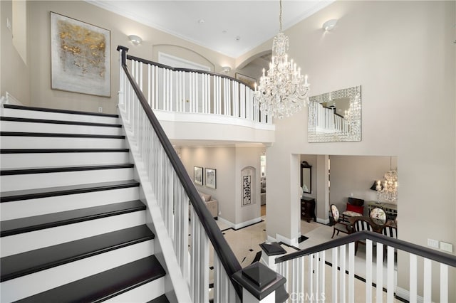 4160 New Hampshire Ave, Claremont, CA 91711 - stairs featuring a chandelier, ornamental molding, baseboards, and a towering ceiling