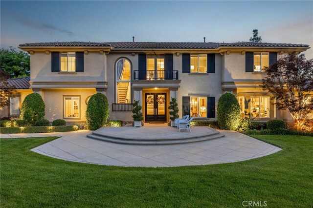 4160 New Hampshire Ave, Claremont, CA 91711 - view of front facade with stucco siding, french doors, a balcony, a tile roof, and a lawn