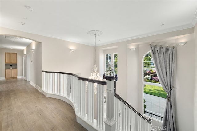 4160 New Hampshire Ave, Claremont, CA 91711 - hall with an upstairs landing, light wood-style floors, crown molding, a chandelier, and arched walkways