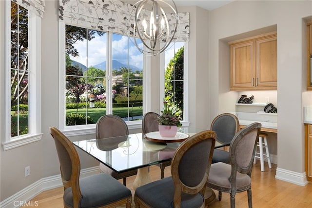 4160 New Hampshire Ave, Claremont, CA 91711 - dining room with a mountain view, healthy amount of natural light, a chandelier, and light wood-style floors