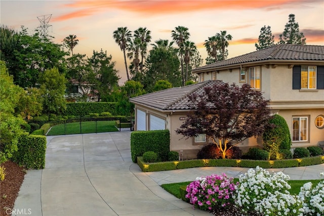 4160 New Hampshire Ave, Claremont, CA 91711 - view of front of property with stucco siding, driveway, and a tiled roof