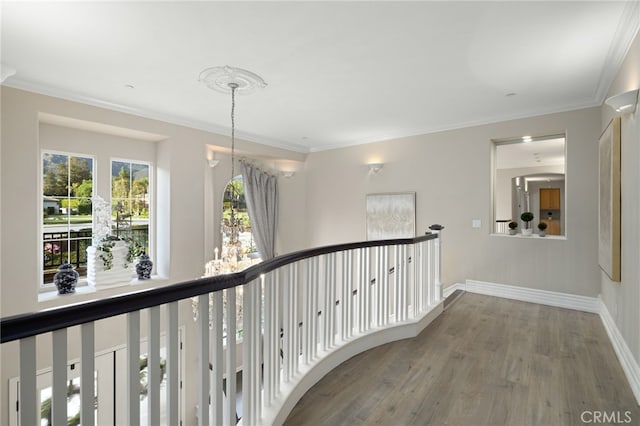 4160 New Hampshire Ave, Claremont, CA 91711 - hall with wood finished floors, an upstairs landing, crown molding, and baseboards