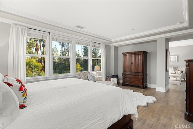 4160 New Hampshire Ave, Claremont, CA 91711 - bedroom with baseboards, light wood finished floors, ornamental molding, and a raised ceiling