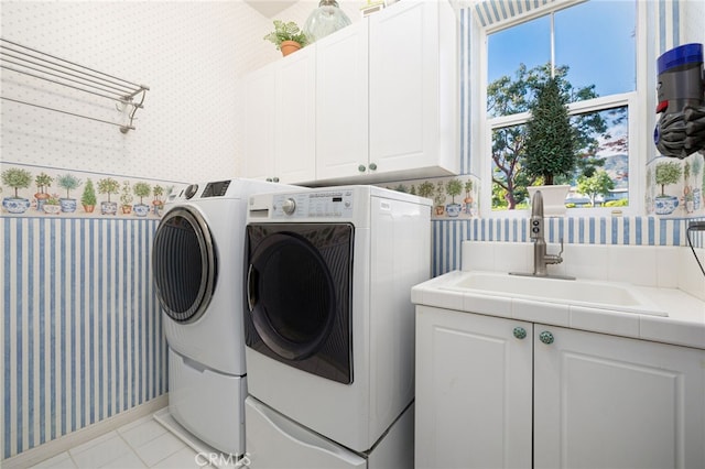 4160 New Hampshire Ave, Claremont, CA 91711 - laundry room with wallpapered walls, cabinet space, independent washer and dryer, tile patterned flooring, and healthy amount of natural light