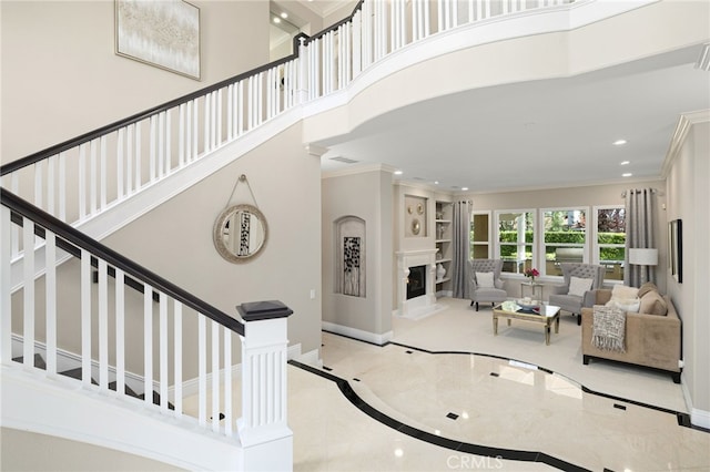 4160 New Hampshire Ave, Claremont, CA 91711 - staircase featuring crown molding, recessed lighting, inlaid floor details, baseboards, and a glass covered fireplace