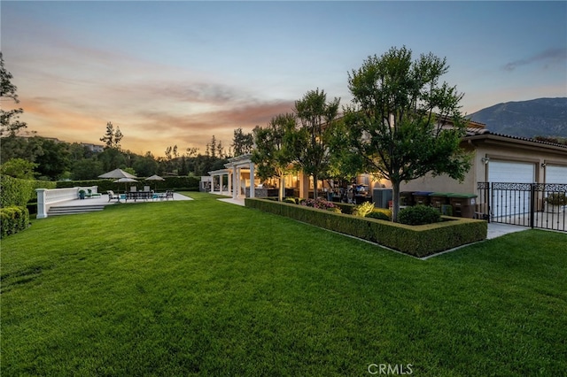 4160 New Hampshire Ave, Claremont, CA 91711 - yard at dusk with a patio and an attached garage