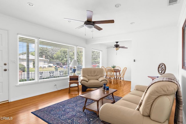 814 Brinsey Ave, Duarte, CA 91010 - living area with a ceiling fan, wood finished floors, healthy amount of natural light, crown molding, and recessed lighting
