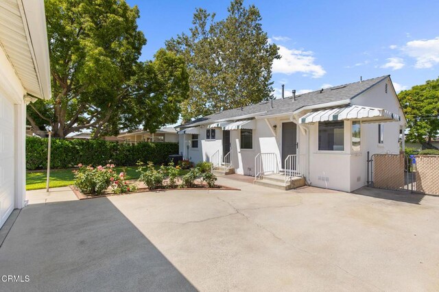 814 Brinsey Ave, Duarte, CA 91010 - view of front of house with a patio area, roof with shingles, and stucco siding