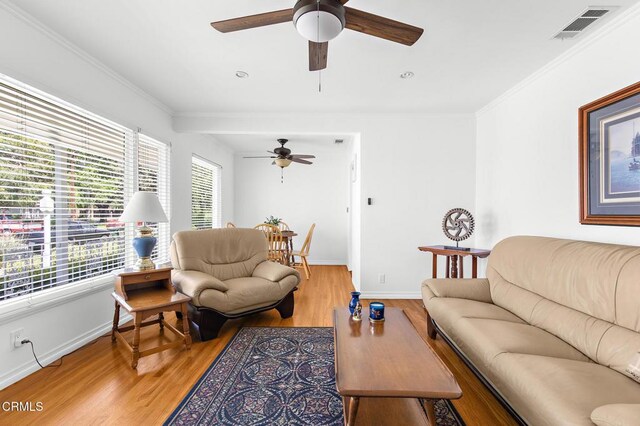 814 Brinsey Ave, Duarte, CA 91010 - living room featuring a ceiling fan, light wood-style flooring, baseboards, and ornamental molding