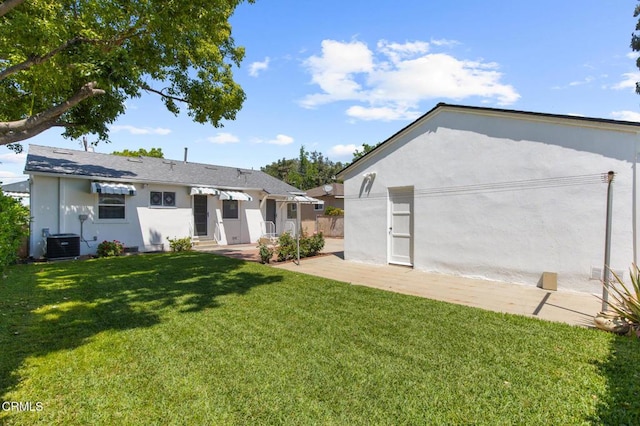 814 Brinsey Ave, Duarte, CA 91010 - back of property featuring central AC unit, stucco siding, a lawn, and a patio area