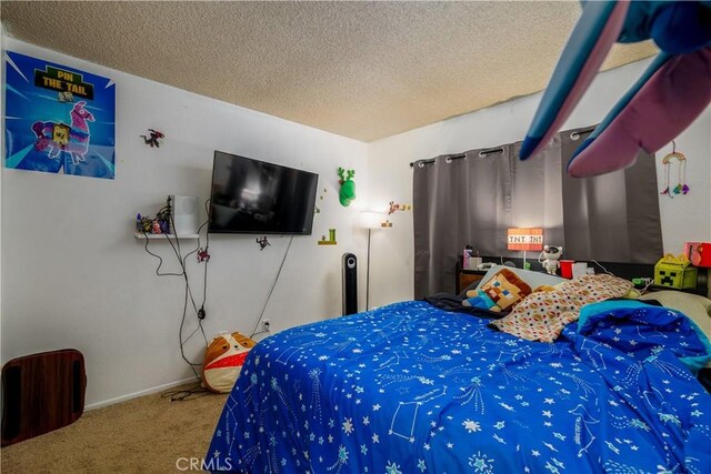 23621 Suncrest Ave, Moreno Valley, CA 92553 - carpeted bedroom with a textured ceiling and baseboards