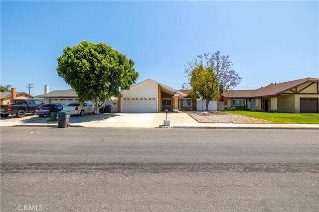 23621 Suncrest Ave, Moreno Valley, CA 92553 - view of front facade featuring an attached garage and concrete driveway