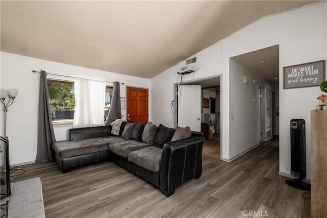 23621 Suncrest Ave, Moreno Valley, CA 92553 - living area with vaulted ceiling, wood finished floors, and a textured ceiling
