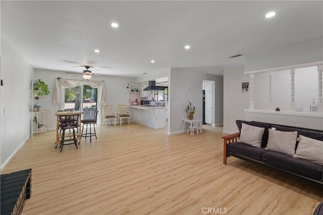 7558 Lobos Ave, Hesperia, CA 92345 - living area featuring light wood-type flooring, recessed lighting, ceiling fan, and baseboards