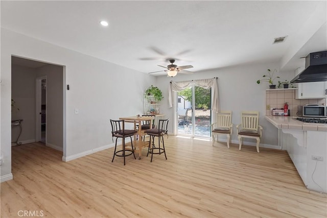 7558 Lobos Ave, Hesperia, CA 92345 - dining space with light wood finished floors, a ceiling fan, baseboards, and recessed lighting