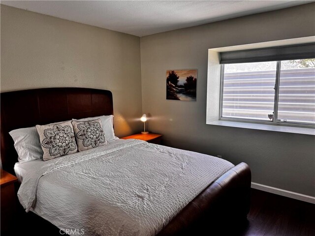 1351 E Gem Cir, Palm Springs, CA 92262 - bedroom featuring wood finished floors and baseboards
