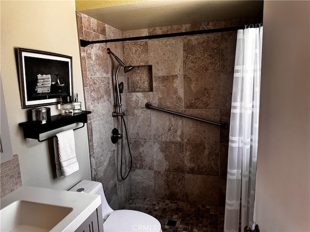 1351 E Gem Cir, Palm Springs, CA 92262 - bathroom featuring tiled shower, toilet, and vanity