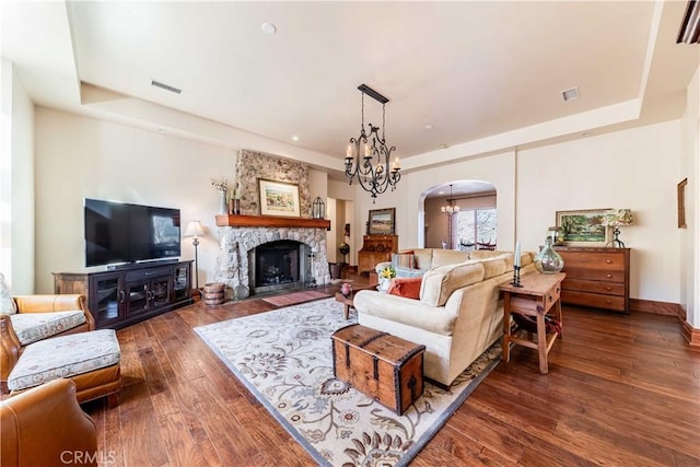 26525 Carancho Rd, Temecula, CA 92590 - living room with a raised ceiling, hardwood / wood-style flooring, and arched walkways
