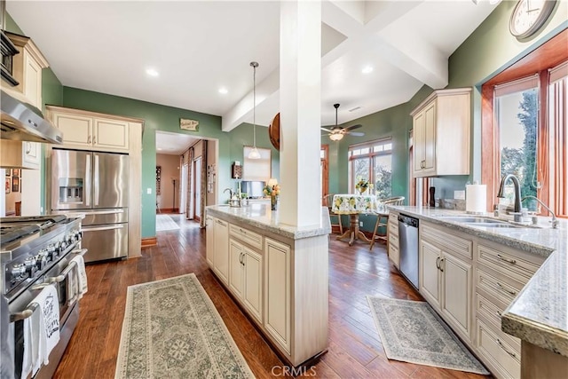 26525 Carancho Rd, Temecula, CA 92590 - kitchen featuring cream cabinets, appliances with stainless steel finishes, a sink, light stone countertops, and dark wood-style floors
