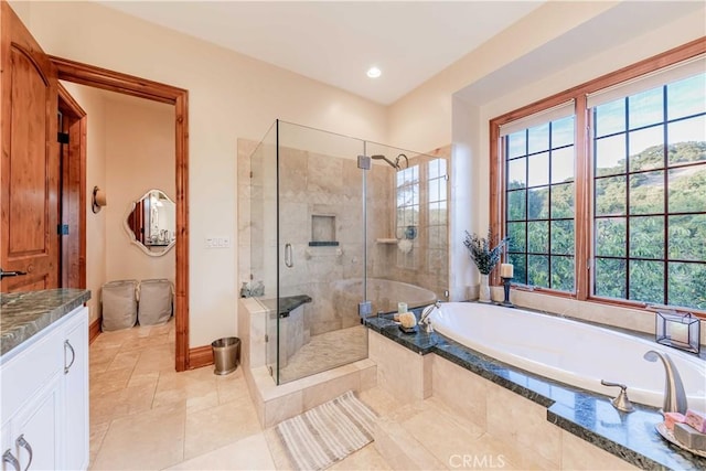 26525 Carancho Rd, Temecula, CA 92590 - bathroom with a garden tub, a stall shower, vanity, baseboards, and tile patterned floors