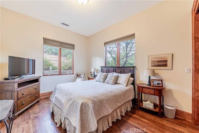 26525 Carancho Rd, Temecula, CA 92590 - bedroom featuring multiple windows, wood-type flooring, and baseboards