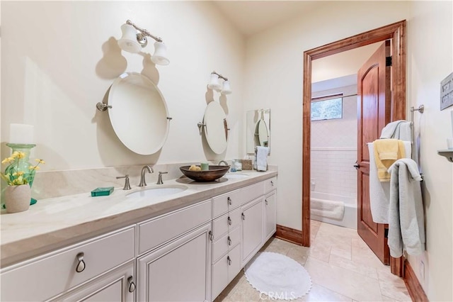 26525 Carancho Rd, Temecula, CA 92590 - bathroom with double vanity, tub / shower combination, tile patterned flooring, and baseboards