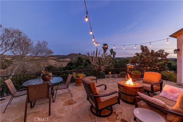 26525 Carancho Rd, Temecula, CA 92590 - view of patio with a fire pit, a mountain view, and outdoor dining space