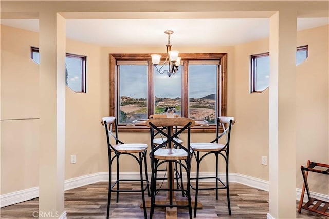 26525 Carancho Rd, Temecula, CA 92590 - dining room featuring wood finished floors, a chandelier, and baseboards