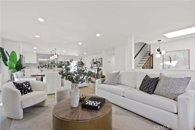 17805 Winterberry St, Fountain Valley, CA 92708 - living area featuring stairs, recessed lighting, light wood-type flooring, and a skylight