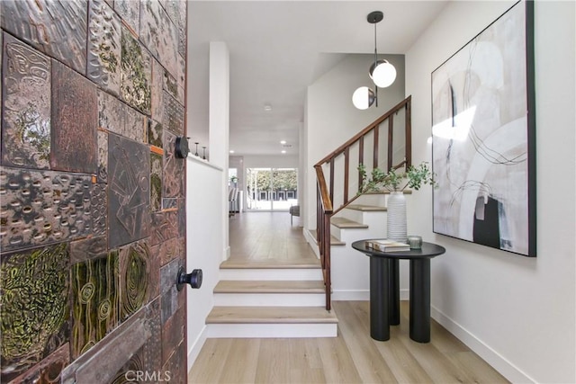 17805 Winterberry St, Fountain Valley, CA 92708 - entryway featuring stairs, wood finished floors, and baseboards