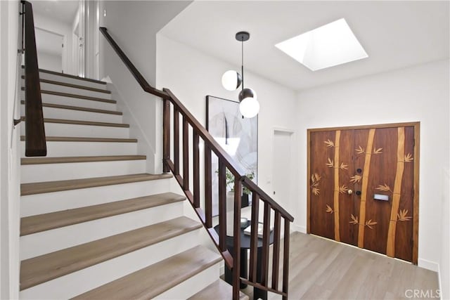 17805 Winterberry St, Fountain Valley, CA 92708 - stairway with a skylight and wood finished floors