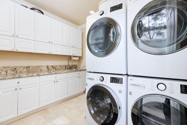 30801 Via Conquista, San Juan Capistrano, CA 92675 - laundry area with cabinet space, stacked washer and clothes dryer, and washing machine and clothes dryer