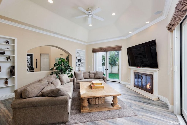 30801 Via Conquista, San Juan Capistrano, CA 92675 - living area with built in features, a ceiling fan, arched walkways, wood finished floors, and recessed lighting